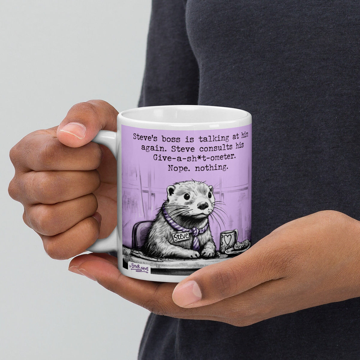 Holding the Give-a-sh*t-ometer otter mug