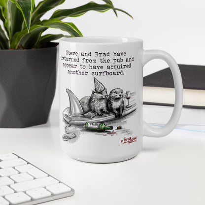 Return From The Pub otter mug, 15 oz, on a desk with a plant and books