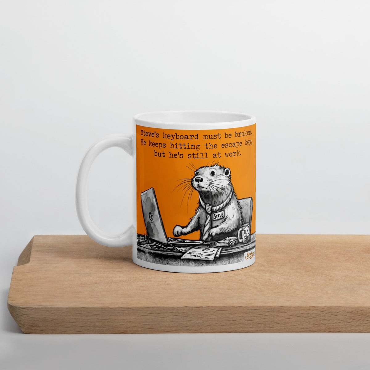 The Escape Key mug on a wooden board