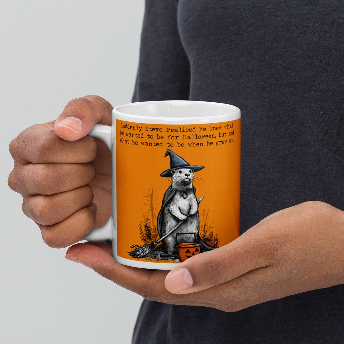 Holding the Halloween otter mug