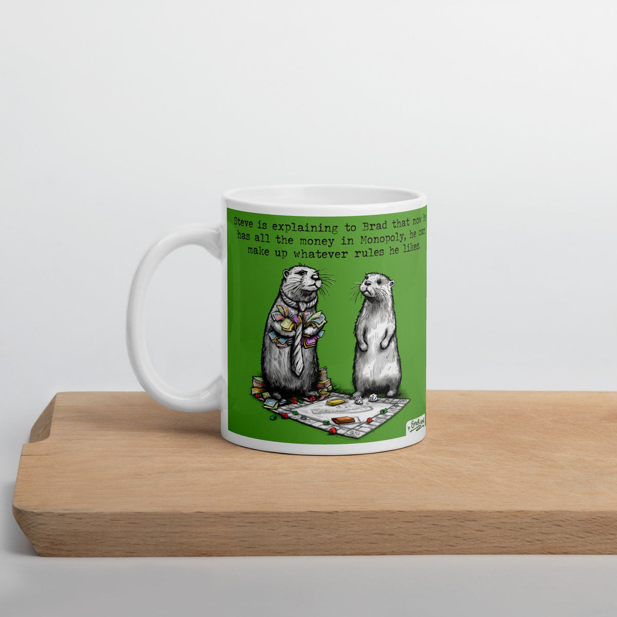 Monopoly mug on a wooden board, side view