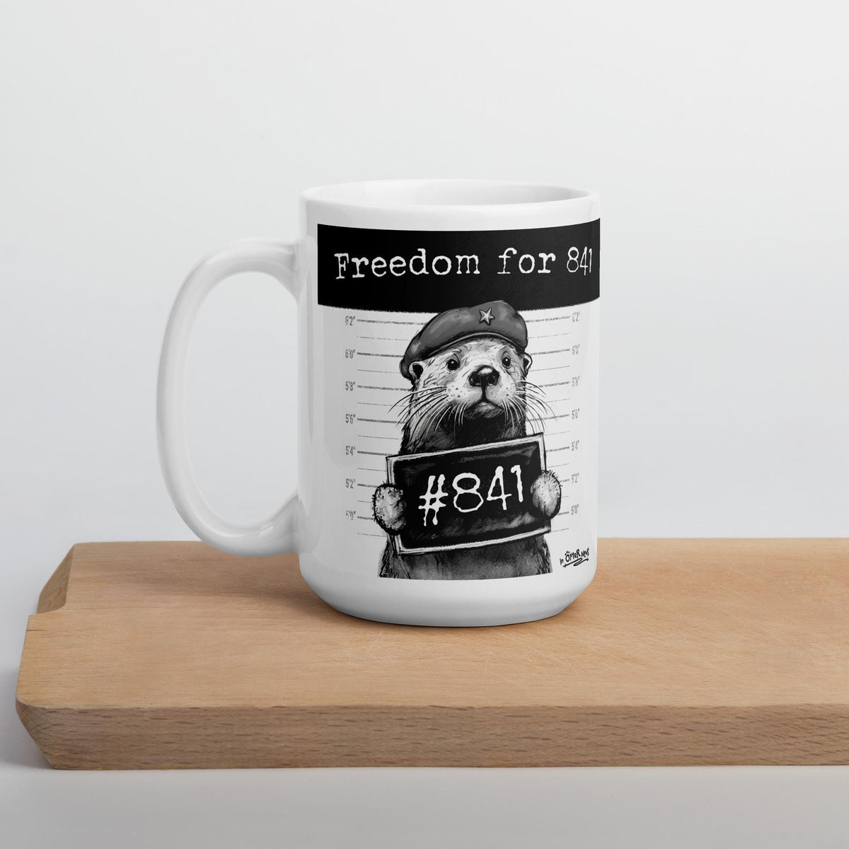 Otter 841 mug on a wooden board, side view