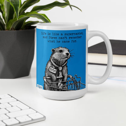 The Supermarket otter mug, 15 oz, on a desk with a plant and books