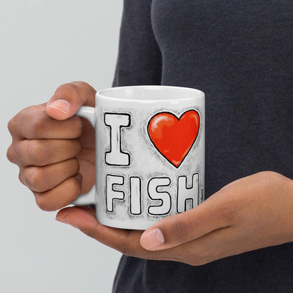 Holding the I Love Fish mug
