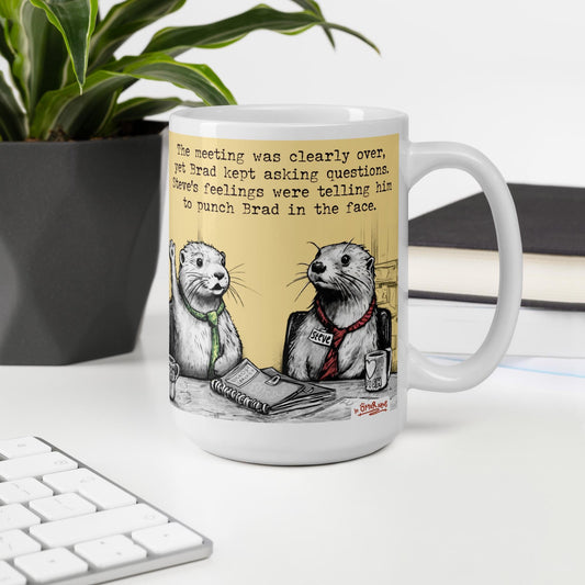 The Meeting Is Over otter mug, 15 oz, on a desk with a plant and books