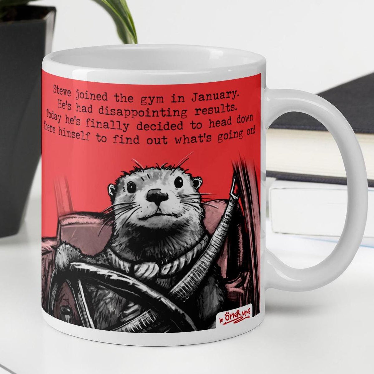 The Gym otter mug, 11 oz, with a plant and books: Steve joined the gym in January