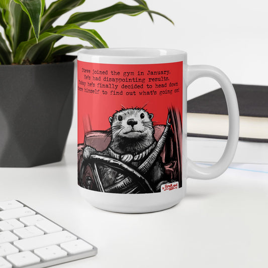 The Gym otter mug, 15 oz, on a desk with a plant and books