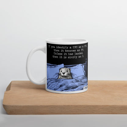 The UFO mug on a wooden board
