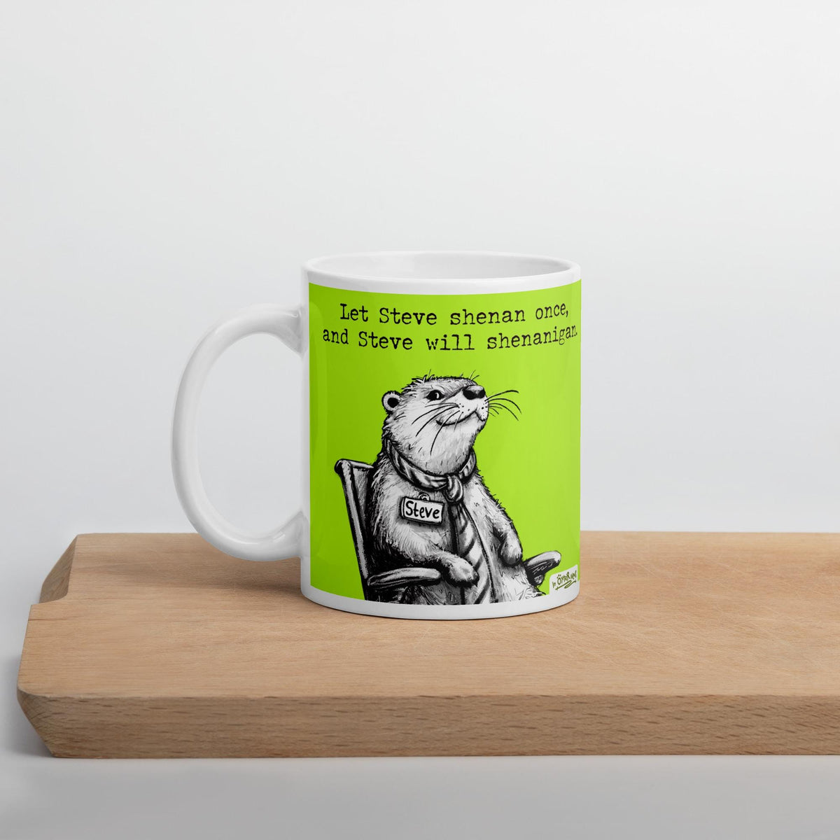 Shenanigans otter mug on a wooden shelf