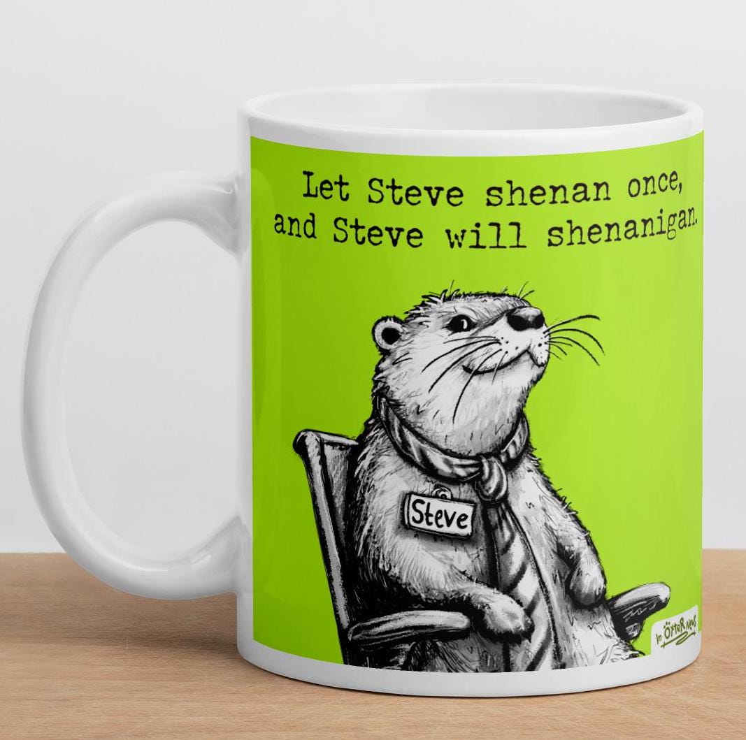Shenanigans otter mug, 11 oz, on a wooden shelf: Steve relaxing in his office chair