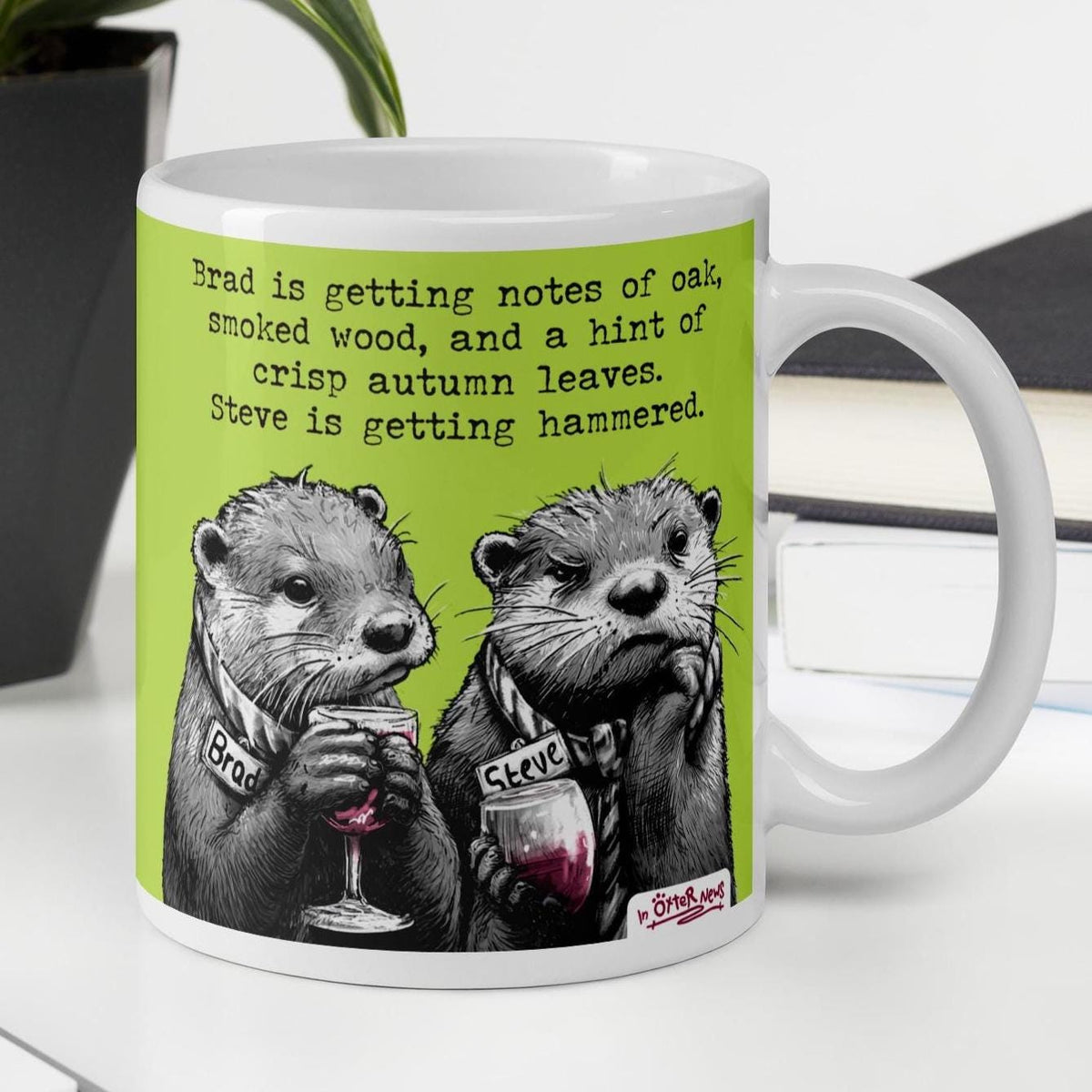 Hammered otter mug, 11 oz, on a desk: Brad and Steve the otters with glasses of wine