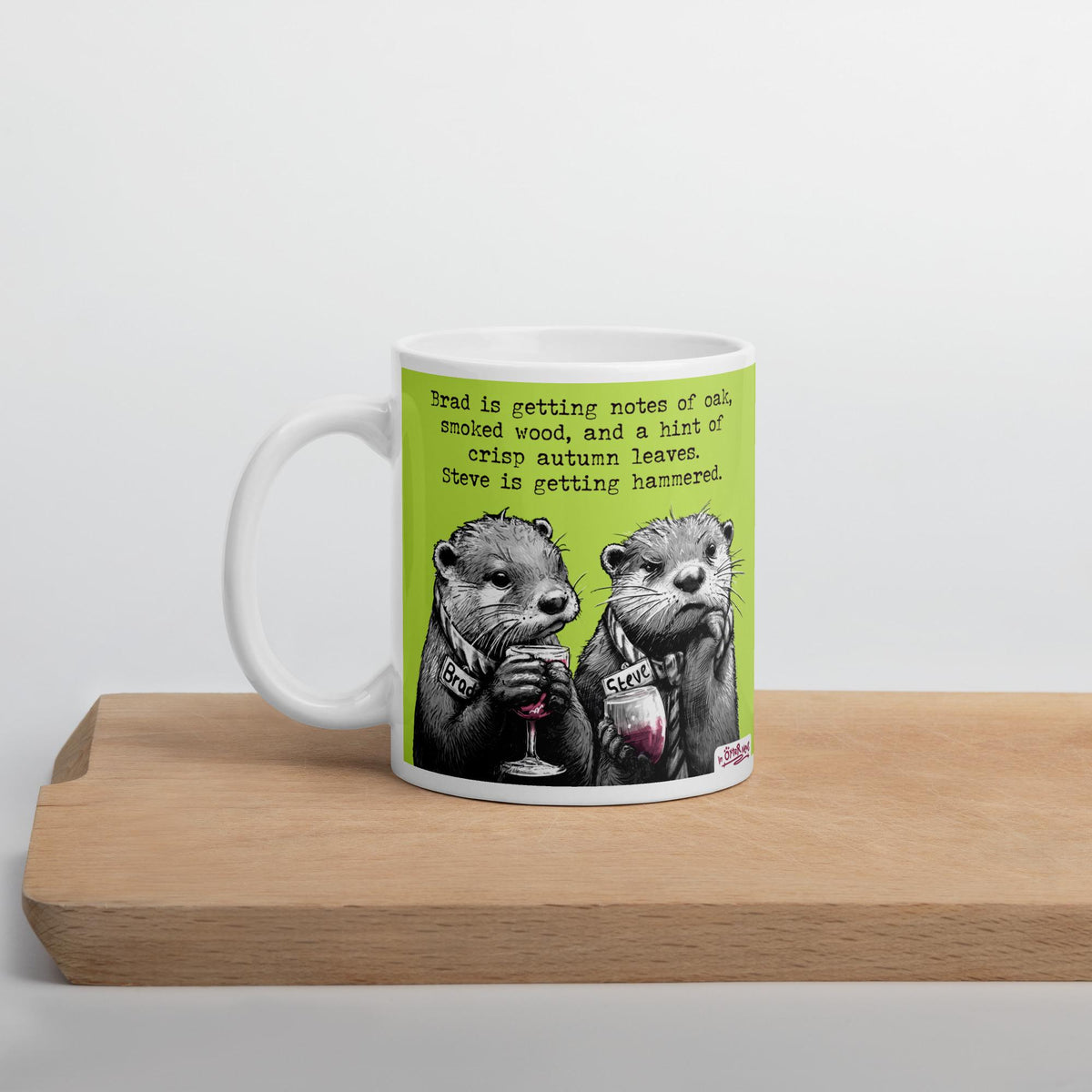 Hammered otter mug on a wooden shelf