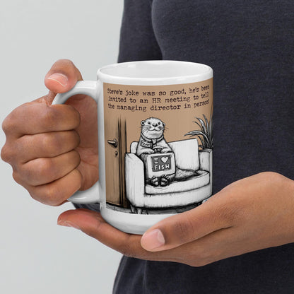 Holding The Joke otter mug by the handle