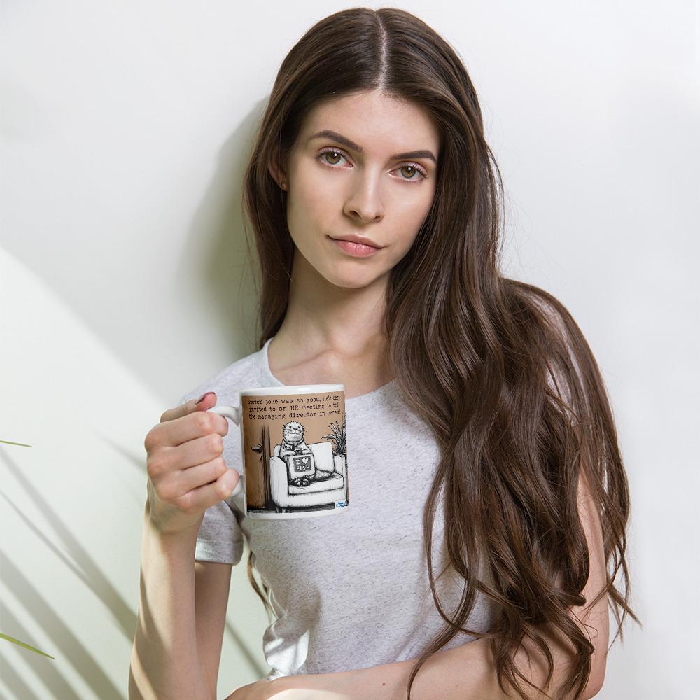 Woman holding The Joke otter mug